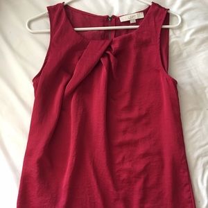 Knotted red sleeveless blouse
